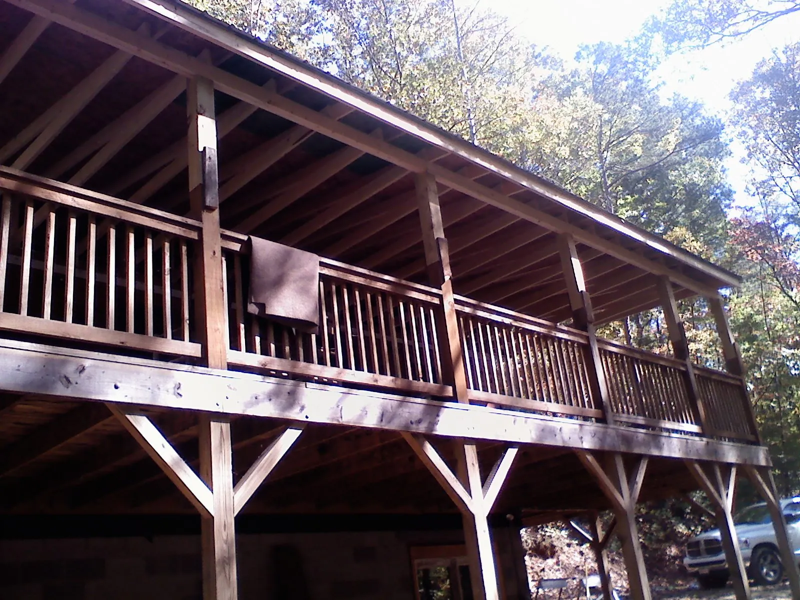Timber framing under a new elevated porch and deck — Roof Leak Repair in Genesee Depot by Roofing Brothers